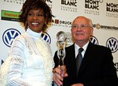 Former Soviet President Mikhail Gorbachev, right, and singer Whitney Houston pose with her award before the beginning of the World Women's Award ceremony in Hamburg's Congress Center, in northern Germany, Wednesday, June 9, 2004 Houston got the World Artist Award for Lifetime Achievement. The Women's World Awards are being presented of the first time this year to extraordinary women in 12 different categories. (AP Photo/Christof Stache, pool) 