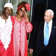 Singers Bobby Brown and Whitney Houston, in Israel for musical inspiration, meet with Ariel Sharon on Tuesday. 
