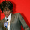 U.S. singer and actress Whitney Houston speaks during a news conference in Shanghai, July 21, 2004. Houston will give a concert in Shanghai on July 22 as part of her China tour. 