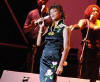 American pop singer Whitney Houston sings during a concert in the Olympic Sports Center in Beijing, capital of China, Sunday, July 25, 2004. The concert, part of Houston's China tour, drew more than 20,000 audience.