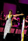 American pop singer Whitney Houston sings during a concert in the Olympic Sports Center in Beijing, capital of China, Sunday, July 25, 2004. The concert, part of Houston's China tour, drew more than 20,000 audience.