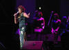 American pop singer Whitney Houston sings during a concert in the Olympic Sports Center in Beijing, capital of China, Sunday, July 25, 2004. The concert, part of Houston's China tour, drew more than 20,000 audience.